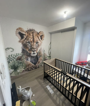 Papel para paredes León joven en la jungla